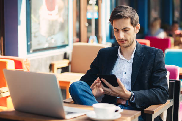 istock Man looking to tablet and touching the screen 930031066