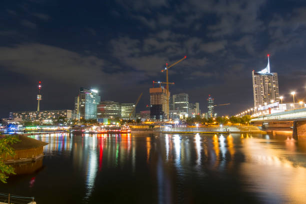 Vienna city at night and Danube river. Austria