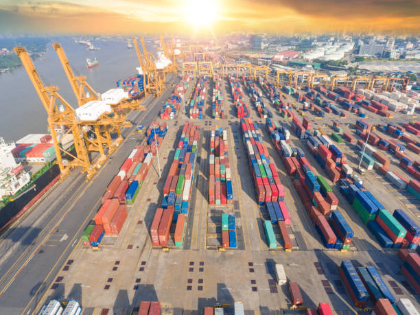 istock Logistics and transportation of Container Cargo ship and Cargo working crane bridge in shipyard 930033934