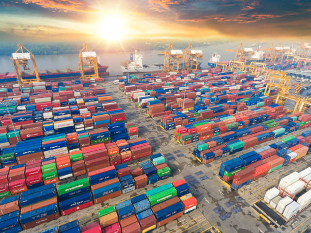 istock Logistics and transportation of Container Cargo ship and Cargo working crane bridge in shipyard 930033972