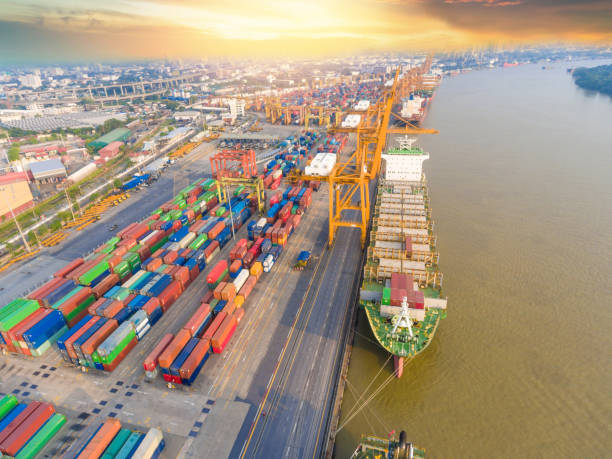 istock Logistics and transportation of Container Cargo ship and Cargo working crane bridge in shipyard 930034188