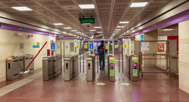 man passes the portico of a subway station - travel passenger milan italy italy imagens e fotografias de stock