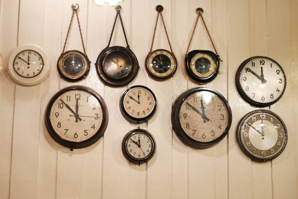 istock Vintage Clock hanging on the woodden wall 930038310
