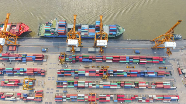 istock Logistics and transportation of Container Cargo ship and Cargo working crane bridge in shipyard 930042738
