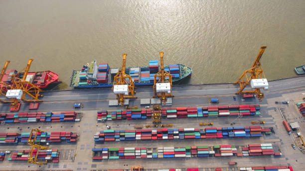 istock Logistics and transportation of Container Cargo ship and Cargo working crane bridge in shipyard 930043490