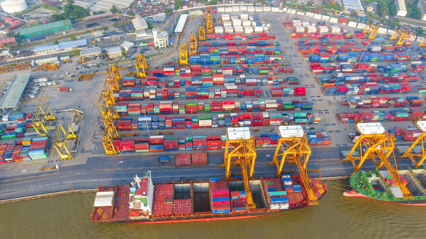 istock Logistics and transportation of Container Cargo ship and Cargo working crane bridge in shipyard 930043512