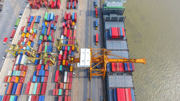 istock Logistics and transportation of Container Cargo ship and Cargo working crane bridge in shipyard 930043650
