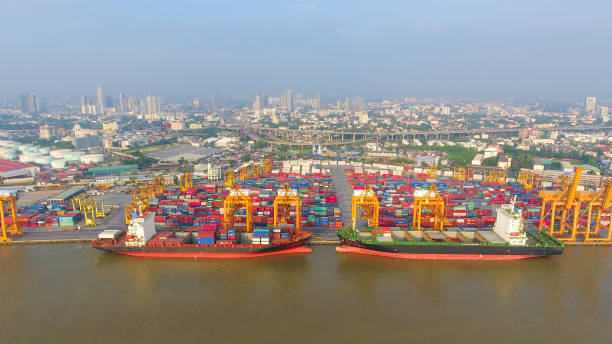 istock Logistics and transportation of Container Cargo ship and Cargo working crane bridge in shipyard 930045998