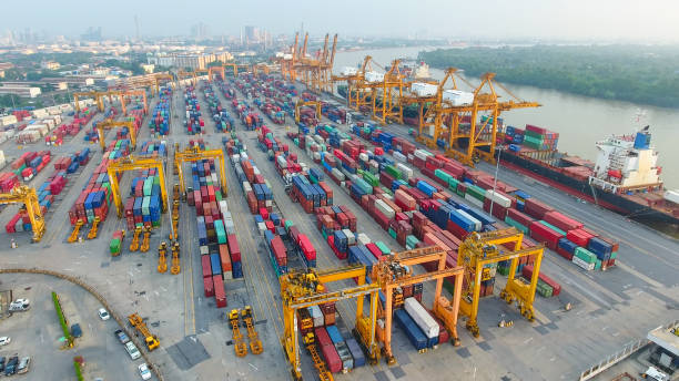 istock Logistics and transportation of Container Cargo ship and Cargo working crane bridge in shipyard 930046084