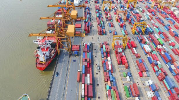 istock Logistics and transportation of Container Cargo ship and Cargo working crane bridge in shipyard 930046098
