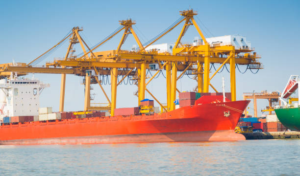 istock Logistics and transportation of Container Cargo ship and Cargo working crane bridge in shipyard 930046324