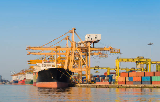 istock Logistics and transportation of Container Cargo ship and Cargo working crane bridge in shipyard 930046496
