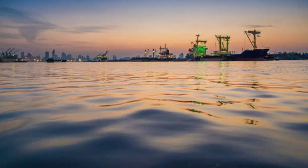 Logistics and transportation of Container Cargo ship and Cargo working crane bridge in shipyard