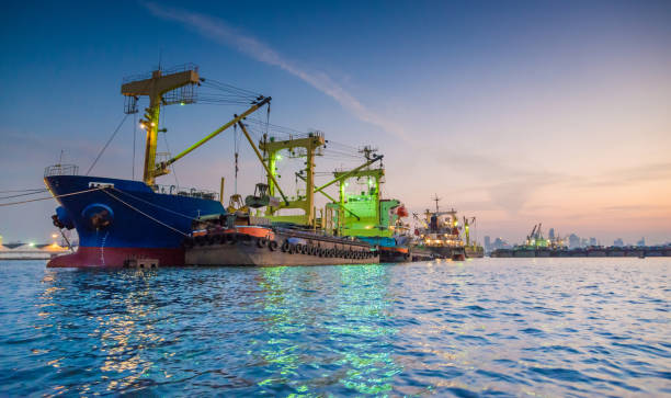 Logistics and transportation of Container Cargo ship and Cargo working crane bridge in shipyard