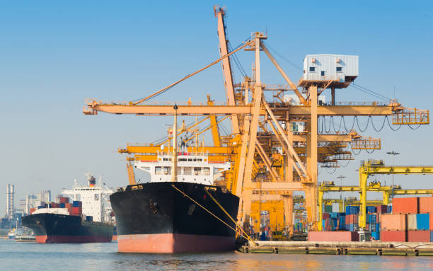istock Logistics and transportation of Container Cargo ship and Cargo working crane bridge in shipyard 930047244