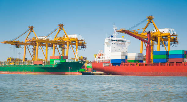 istock Logistics and transportation of Container Cargo ship and Cargo working crane bridge in shipyard 930047246