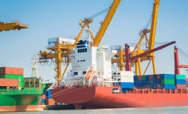 istock Logistics and transportation of Container Cargo ship and Cargo working crane bridge in shipyard 930047248