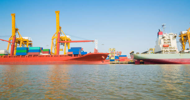 istock Logistics and transportation of Container Cargo ship and Cargo working crane bridge in shipyard 930047256