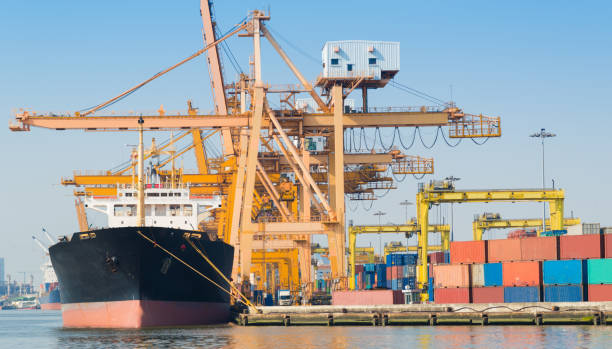 istock Logistics and transportation of Container Cargo ship and Cargo working crane bridge in shipyard 930047722