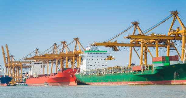istock Logistics and transportation of Container Cargo ship and Cargo working crane bridge in shipyard 930049908