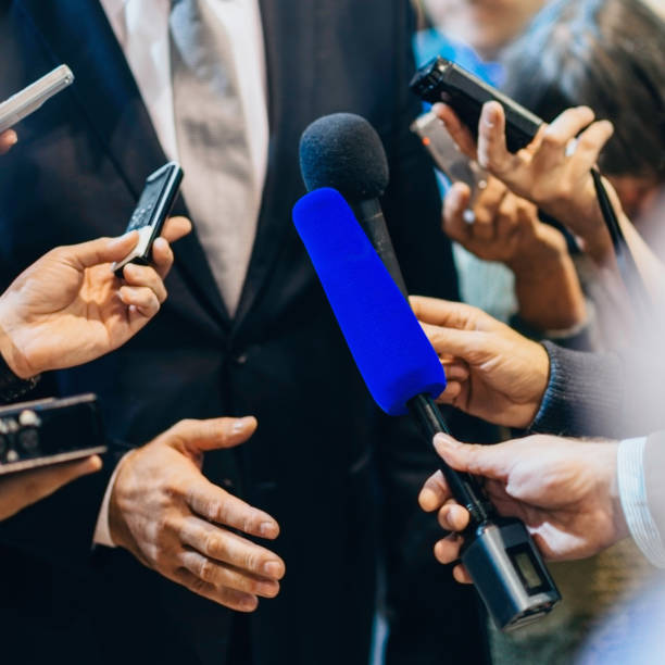 istock Politician answering media questions in casual interview 930054966