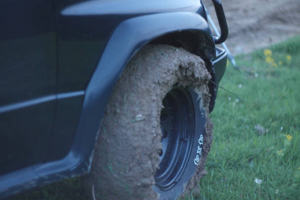 istock off road car tire full of mud 930055406