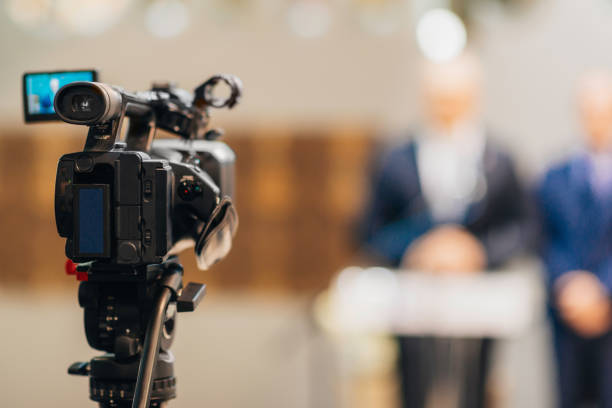 Television camera at a press conference Television camera at a press conference publicity event stock pictures, royalty-free photos & images
