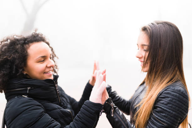 istock Young females having an emotional goodbye 930062014