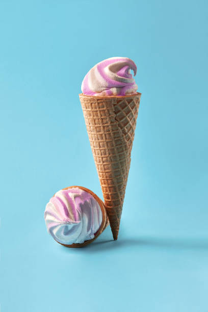 istock Ice cream in waffle cups, white and purple on light blue background 930062518