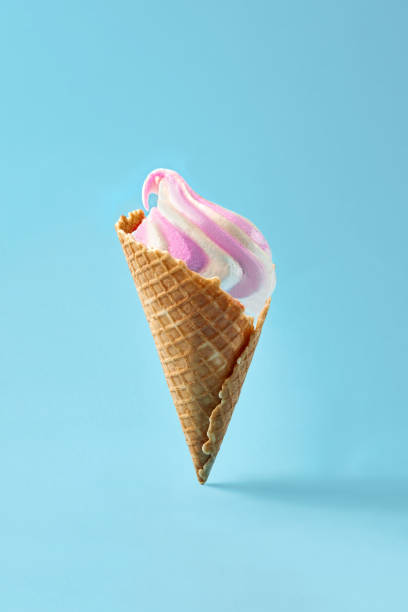 istock Ice cream in waffle cup, white and purple on light blue background 930063674