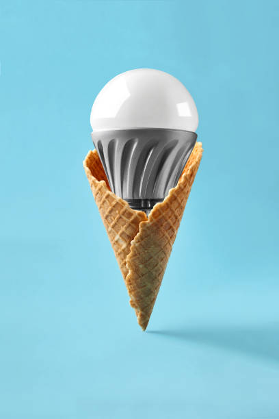 istock Led lamp in ice cream cone, innovation concept 930064188