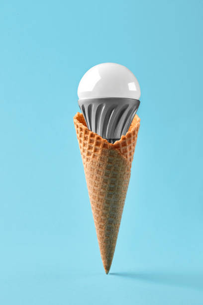 istock Led lamp in ice cream cone, innovation concept 930064490