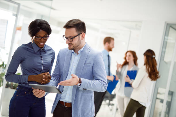 istock Teamwork and technology - Invaluable to modern business 930064972