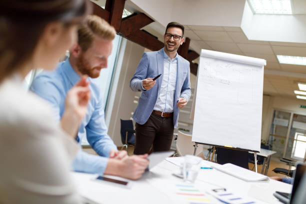 istock Businessman is presenting new project to partners in the office 930067628