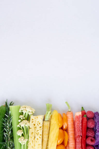 istock Flat lay of rainbow gradient of raw fruit and vegetables on white background 930068942