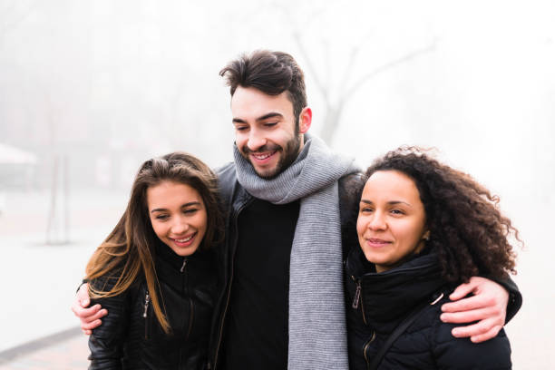 istock Curly-haired girl walking with her step bother and sister 930071330