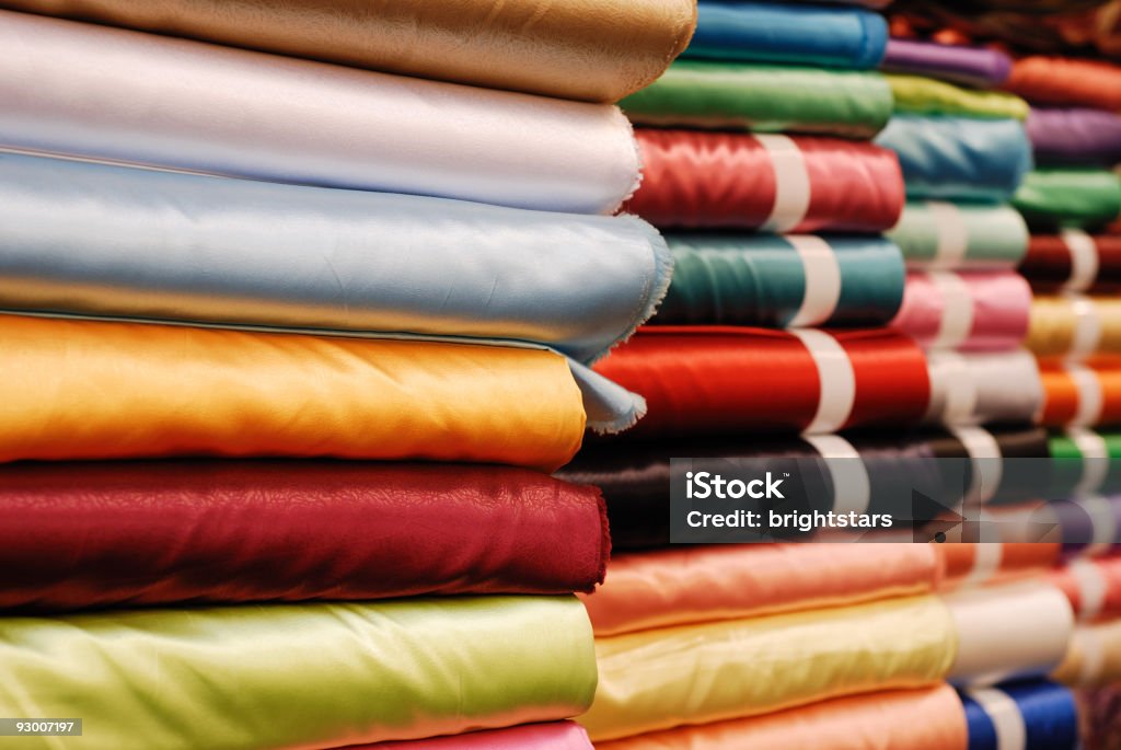 Rolled up satin in a fabric shop  Fabric Shop Stock Photo