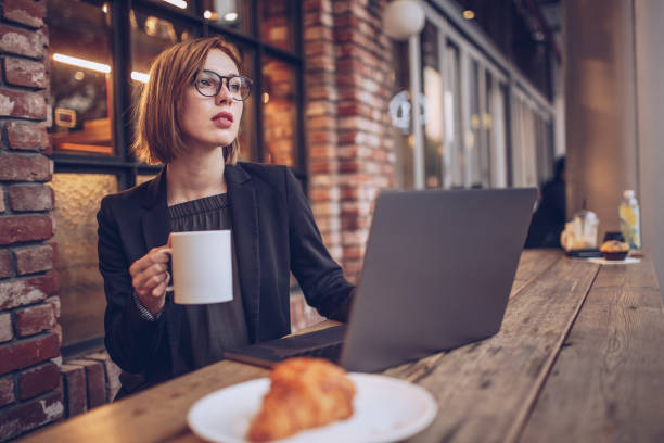istock Businesswoman working in cafe 930072532