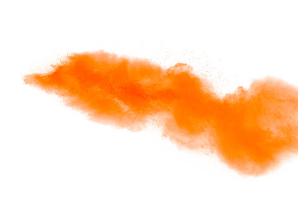 istock abstract orange dust explosion on white background. abstract orange powder splattered on white background, Freeze motion of orange powder splash. 930072950