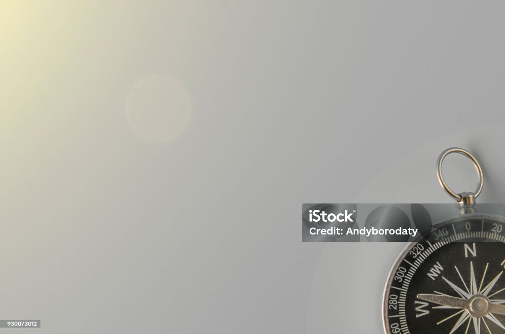 compass on gray background compass on gray background concept - direction motion top view"n Honesty Stock Photo