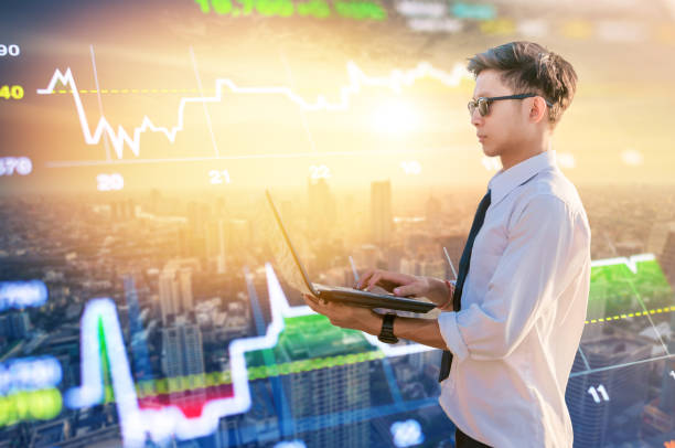 istock Business using laptop and digital tablet at skyscaper background 930078680