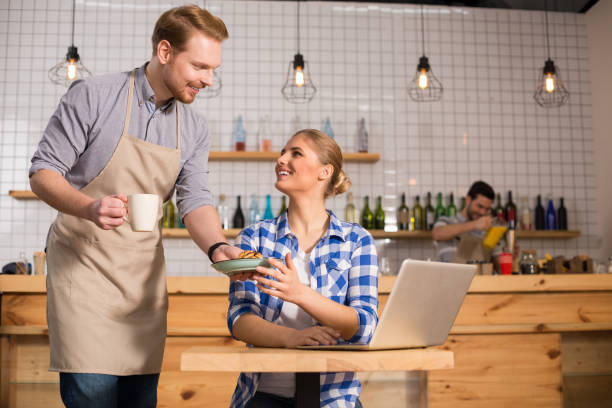 istock Delighted nice waiter serving food 930083454
