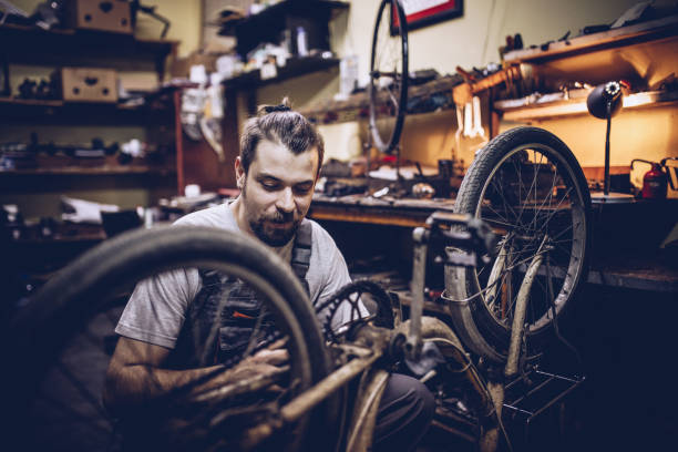 istock Handsome bike repairman 930083958
