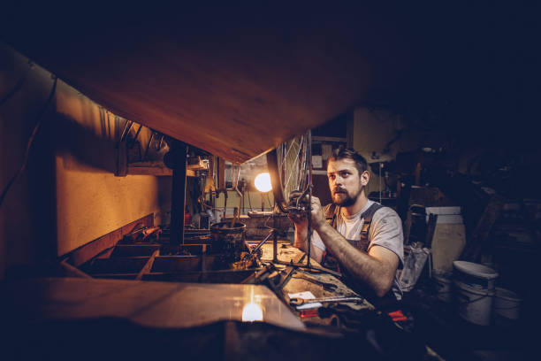 istock Busy repairman works late 930087222