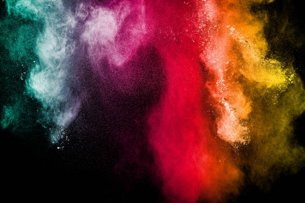 istock Multicolored powder explosion cloud isolated on black background. Freeze motion of color dust  particles splash. 930091026