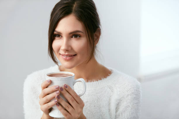 istock Drink. Woman Drinking Hot Drink 930096158