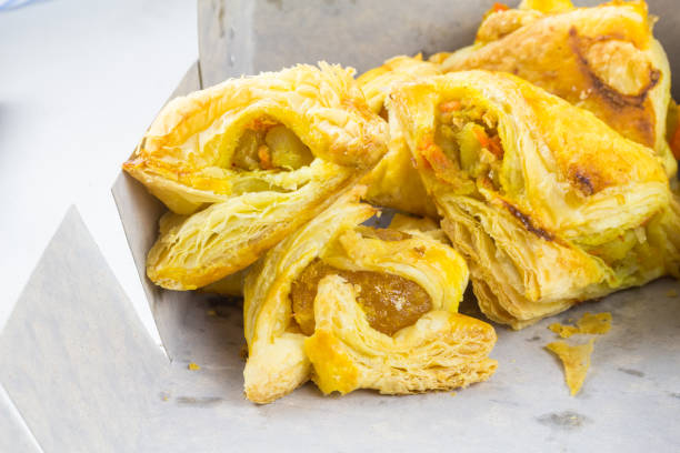 istock Chicken Pie is cut into pieces in a paper box, it is fast food. 930098812