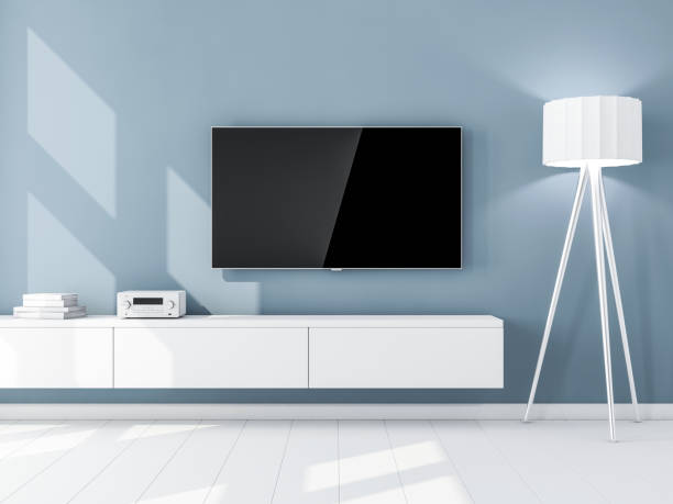 istock Smart Tv Mockup with blank screen hanging on the blue wall, living room 930099028
