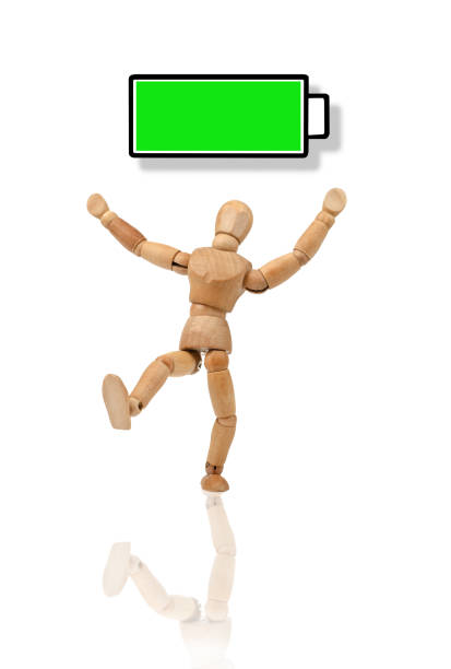 istock Wooden mannequin with full energy, battery - dancing happy 930099806