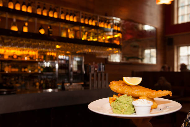 Plate of fish and chips in a restaurant stock photo